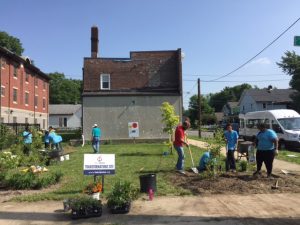 Photo of people working on garden project in River West neighborhood.
