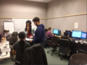 IU Student Success Corps tutors and mentors working with students before moving the program online due to COVID-19.