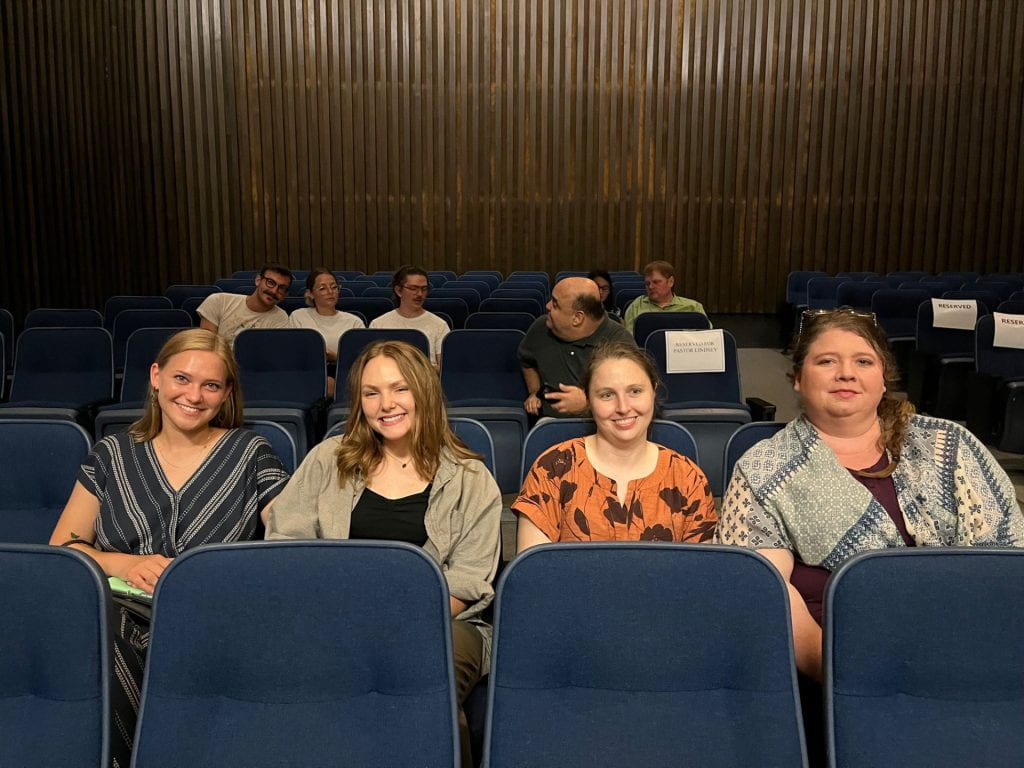 Anthropology students turn out for the reading of the resolution honoring Professor Paul Mullins.  Left to right, Lauren White, Clara Peters, Meghan Meadows, Shauna Keith